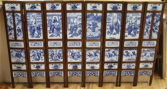A 19th century Chinese blue and white porcelain panelled screen length 136cm